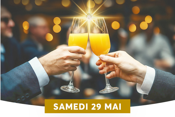 Deux personnes en costume trinquent avec des fl�tes remplies de jus d'orange, sous un effet lumineux en forme d'�toile au point de contact des verres, dans une ambiance festive et �l�gante. Le texte 